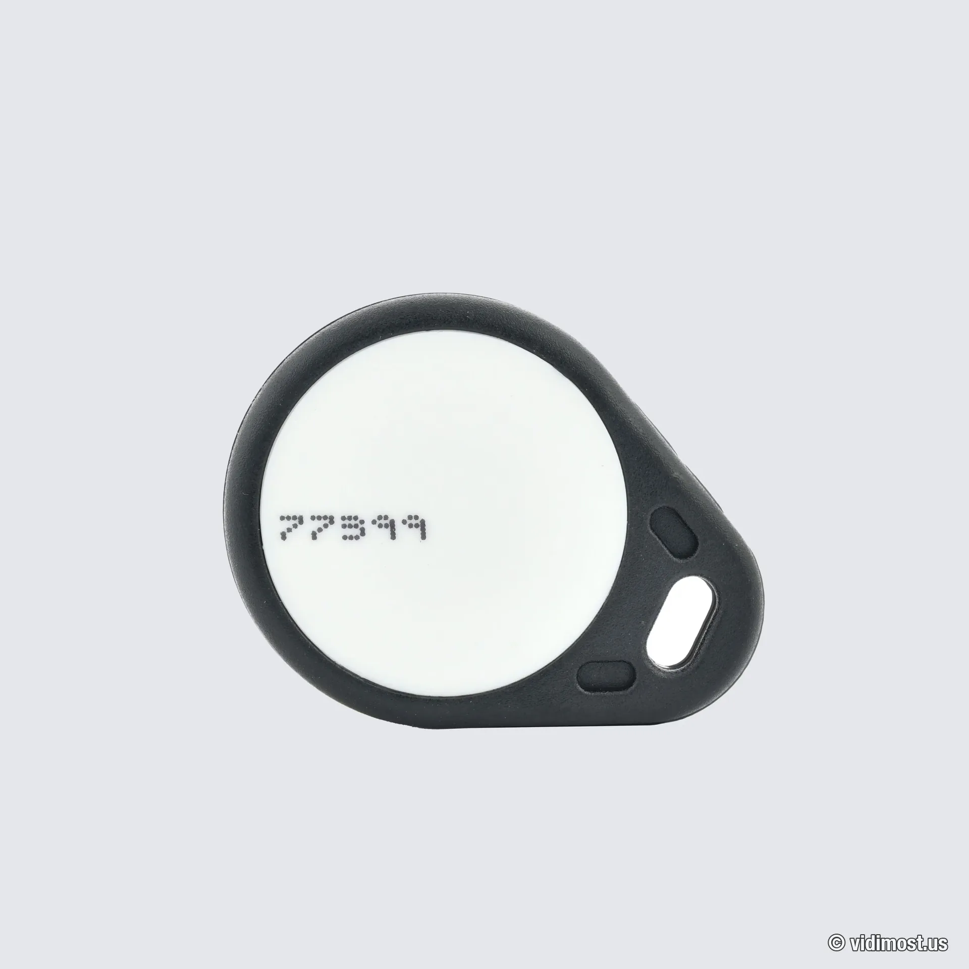 Brivo EV3 smart key fob, black teardrop housing with a white face and printed credential number